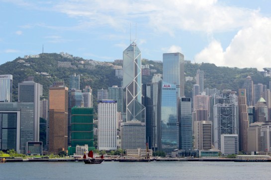 The Hong Kong skyline today, and the lone junk still plying the waters of the harbour.  