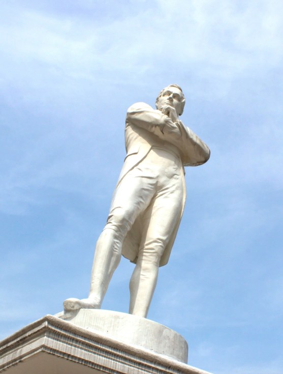 Statue of Sir Thomas Stamford Raffles, at his purported landing site, along the Singapore River.
