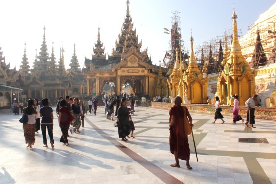 Lone monk amidst the visiting worshippers, Shwedagon Pagoda. 